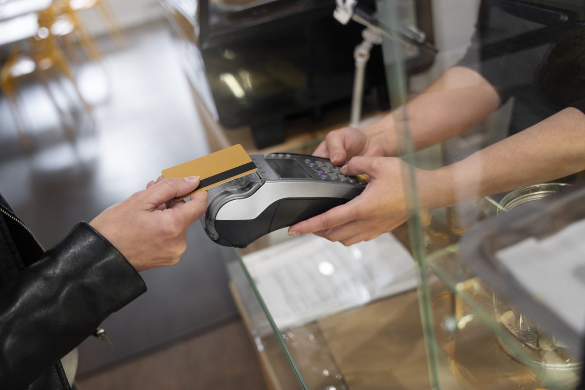 person-paying-using-nfc-technology person-paying-using-nfc-technology